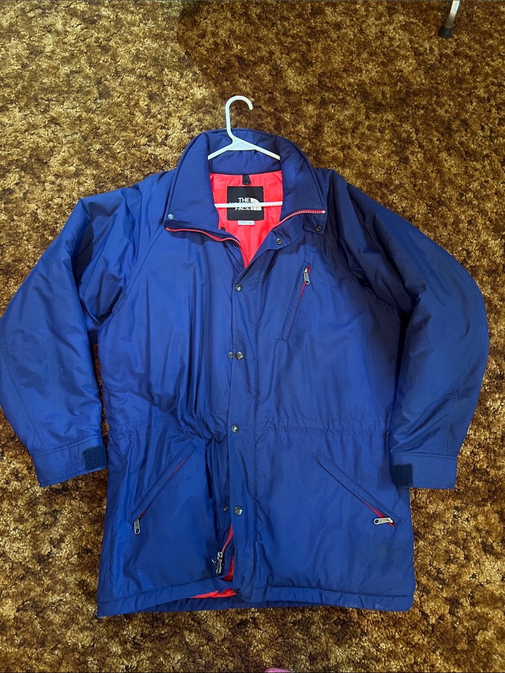 The North Face Blue Raincoat with Red Lining